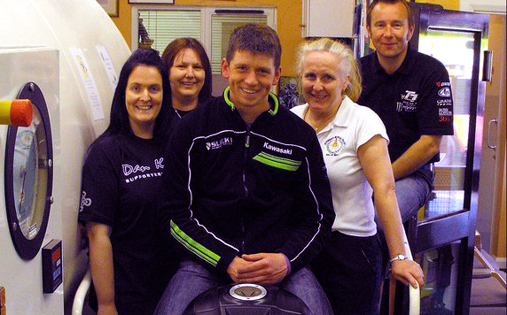 (left to right) Lizzie and Jane from Dan Kneen's supporters club, Dan, Clare Duchars from the chamber and Chris Heyes from the Martyn Heyes Memorial Fund at the launch of the charity badge